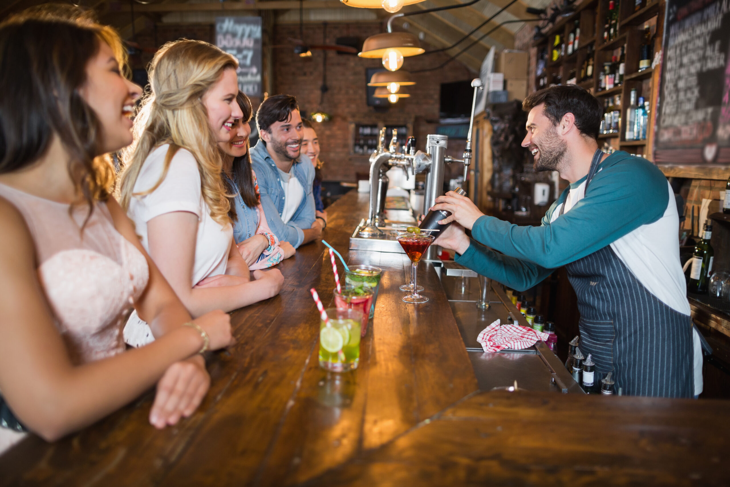 cheerful-bartender-interacting-with-customers