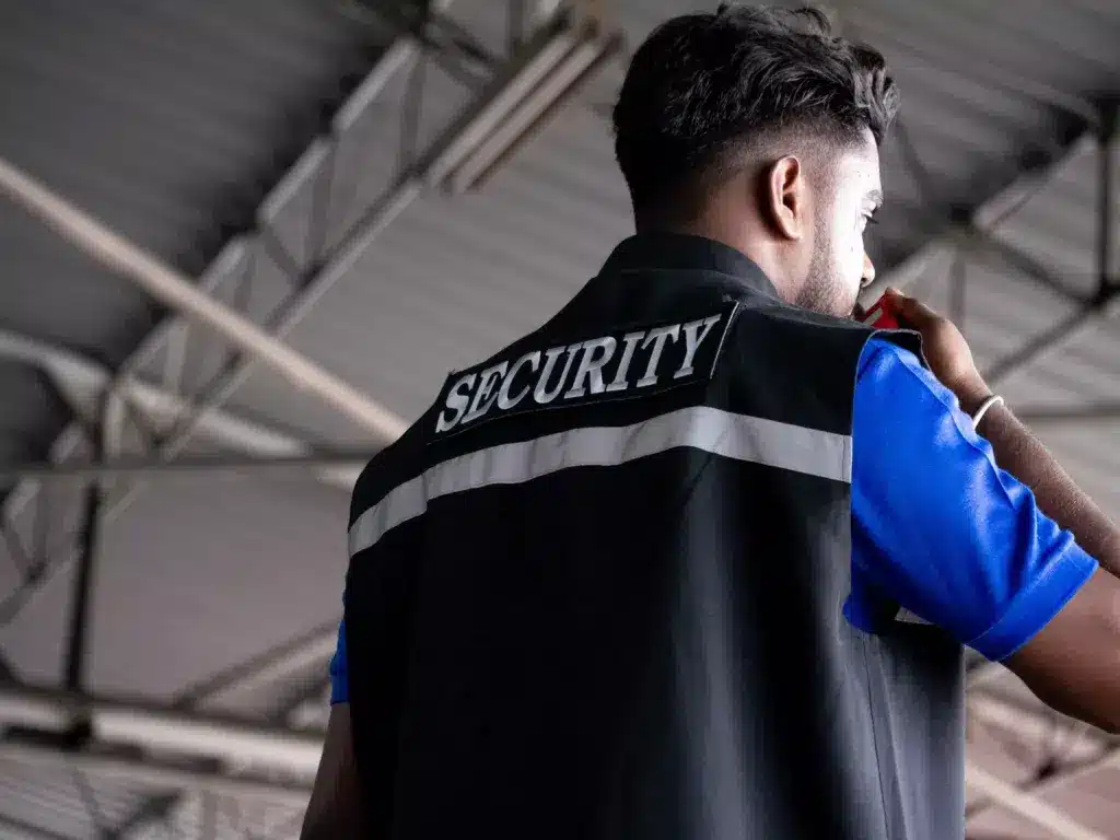 man-backside-person-wear-shirt-security-talk-speak-2023-11-27-05-07-36-utc-min