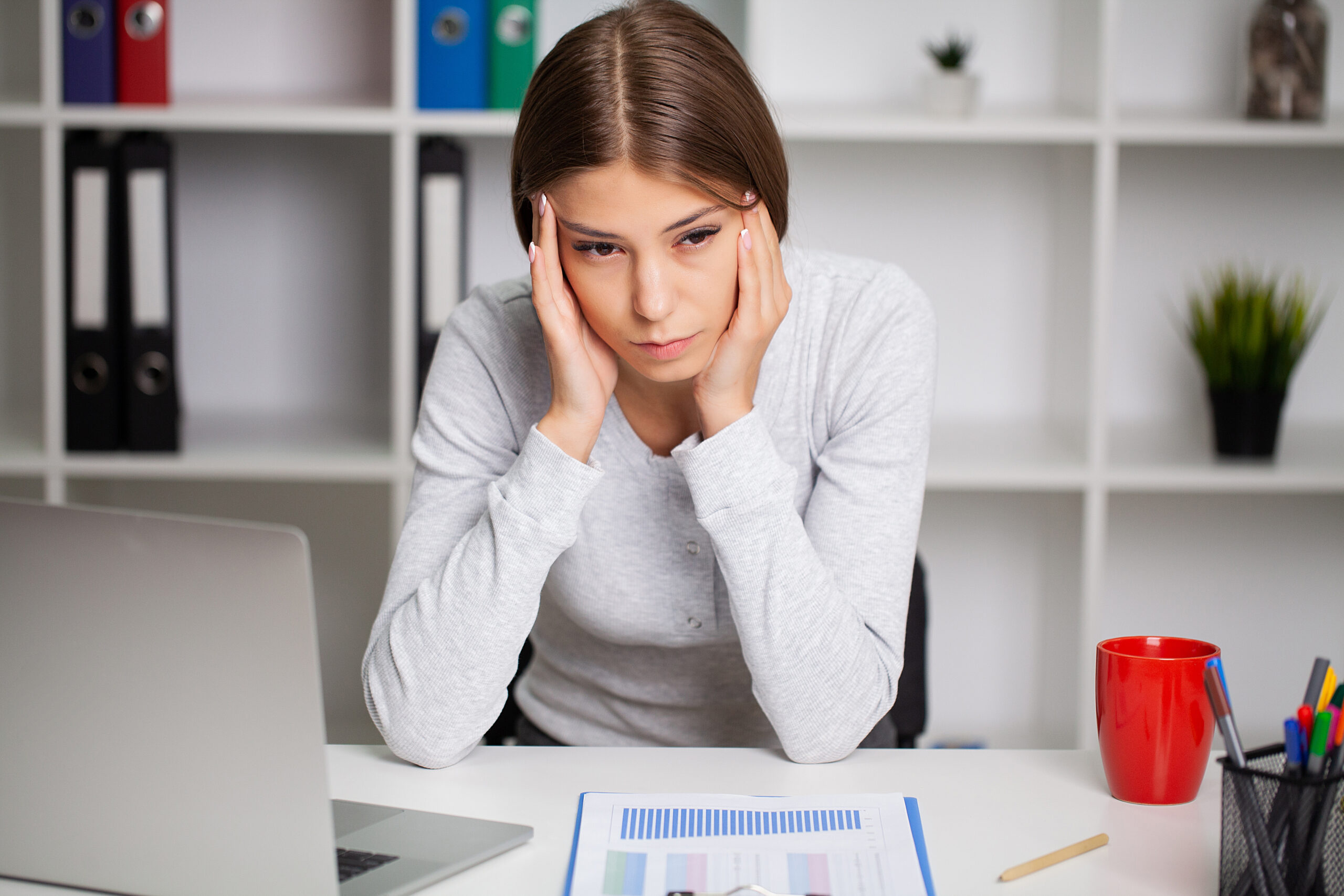 Young woman suffer from dizziness or vertigo holding her head.