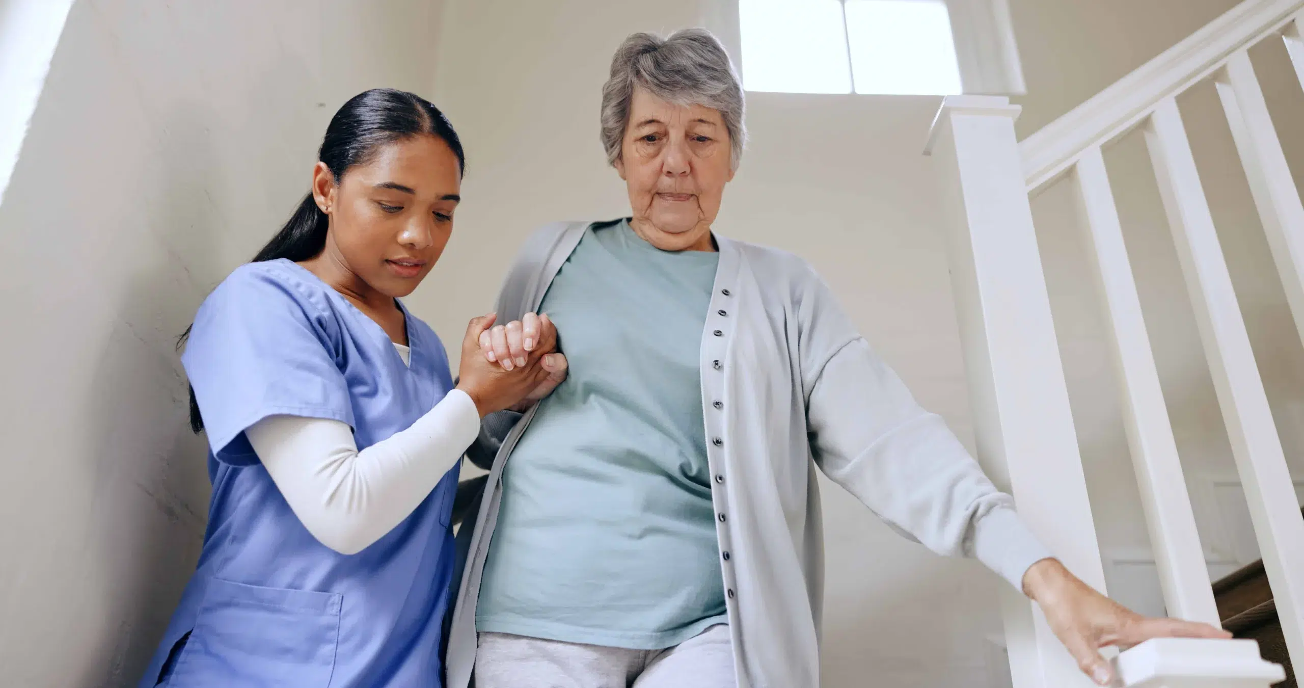 Female student caring for aged client at STC Perth training