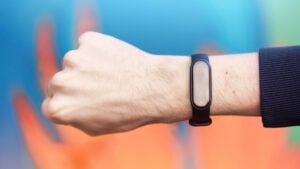 A male hand clenched into a fist with medic alert bracelet