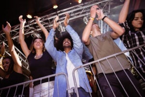 Low angle view of crowd enjoying at nightclub during music festival crowd management