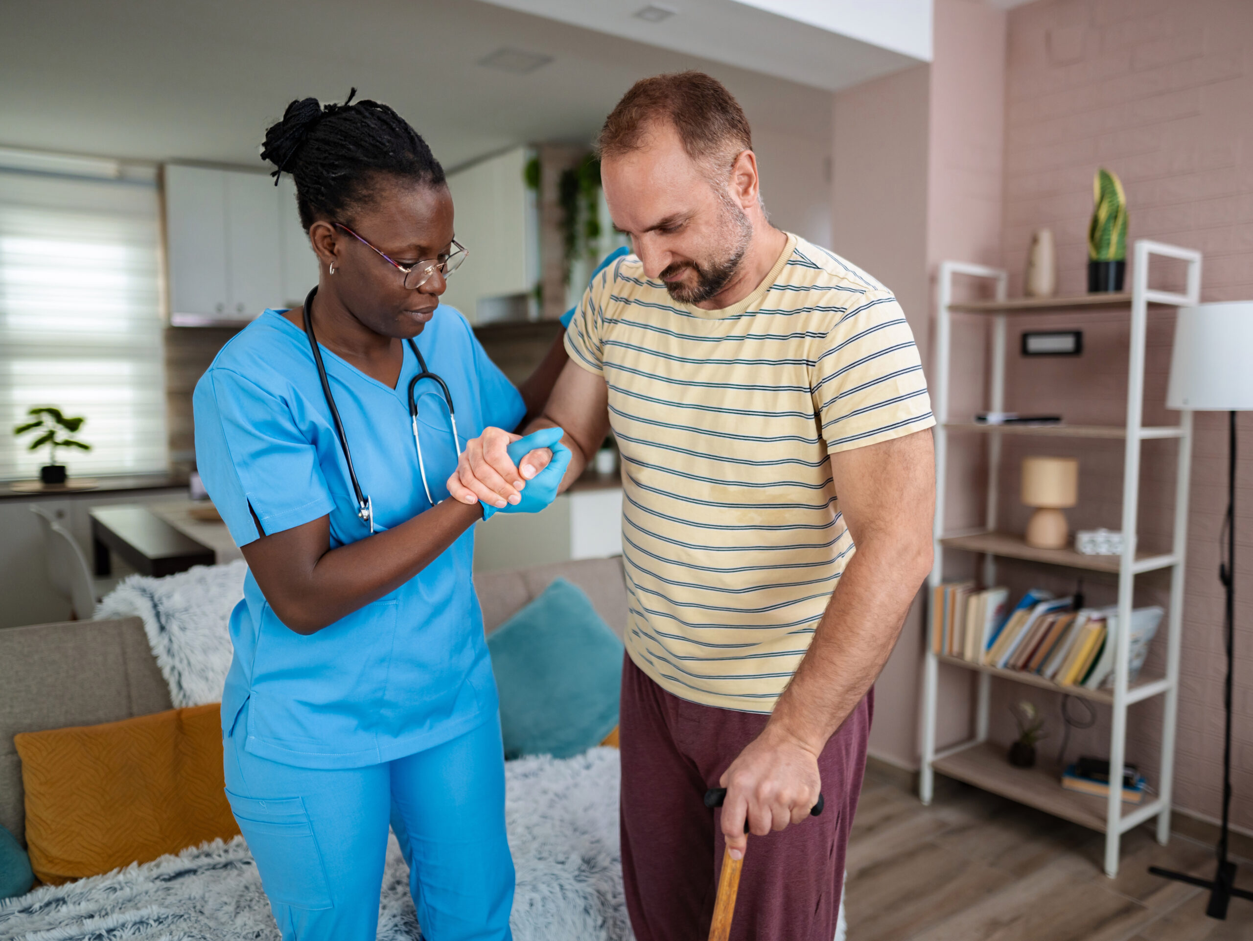 Healthcare professional supports patient during rehabilitation