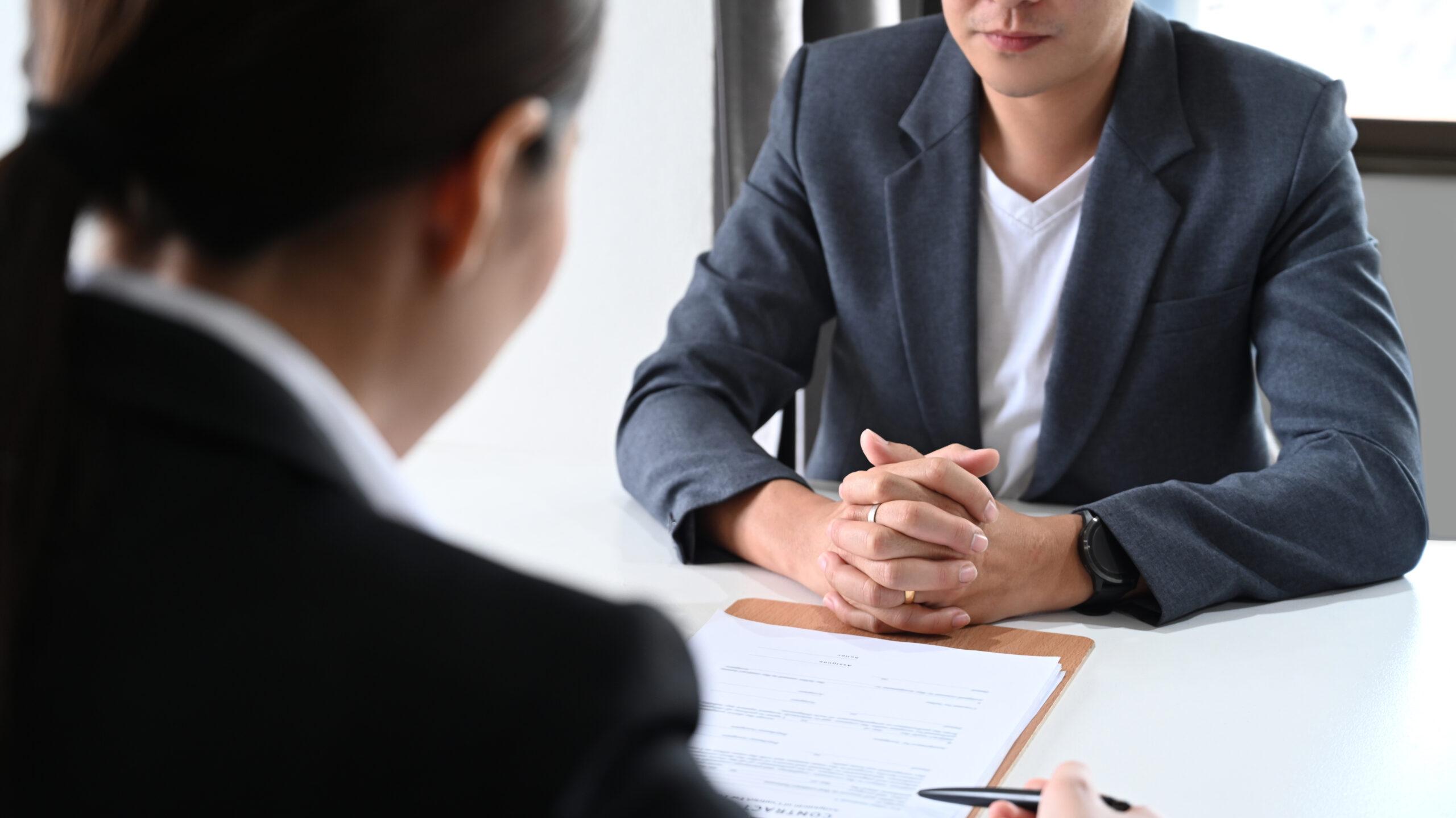 Male investor discussing investment plan with female lawyer or financial advisor. job interview