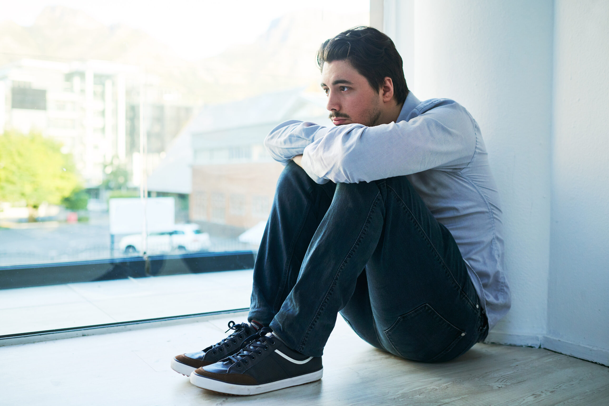 Shot of a young man suffering from a mental breakdown.