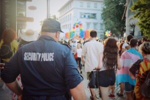 security crowd control worker guard on street busy festival parade