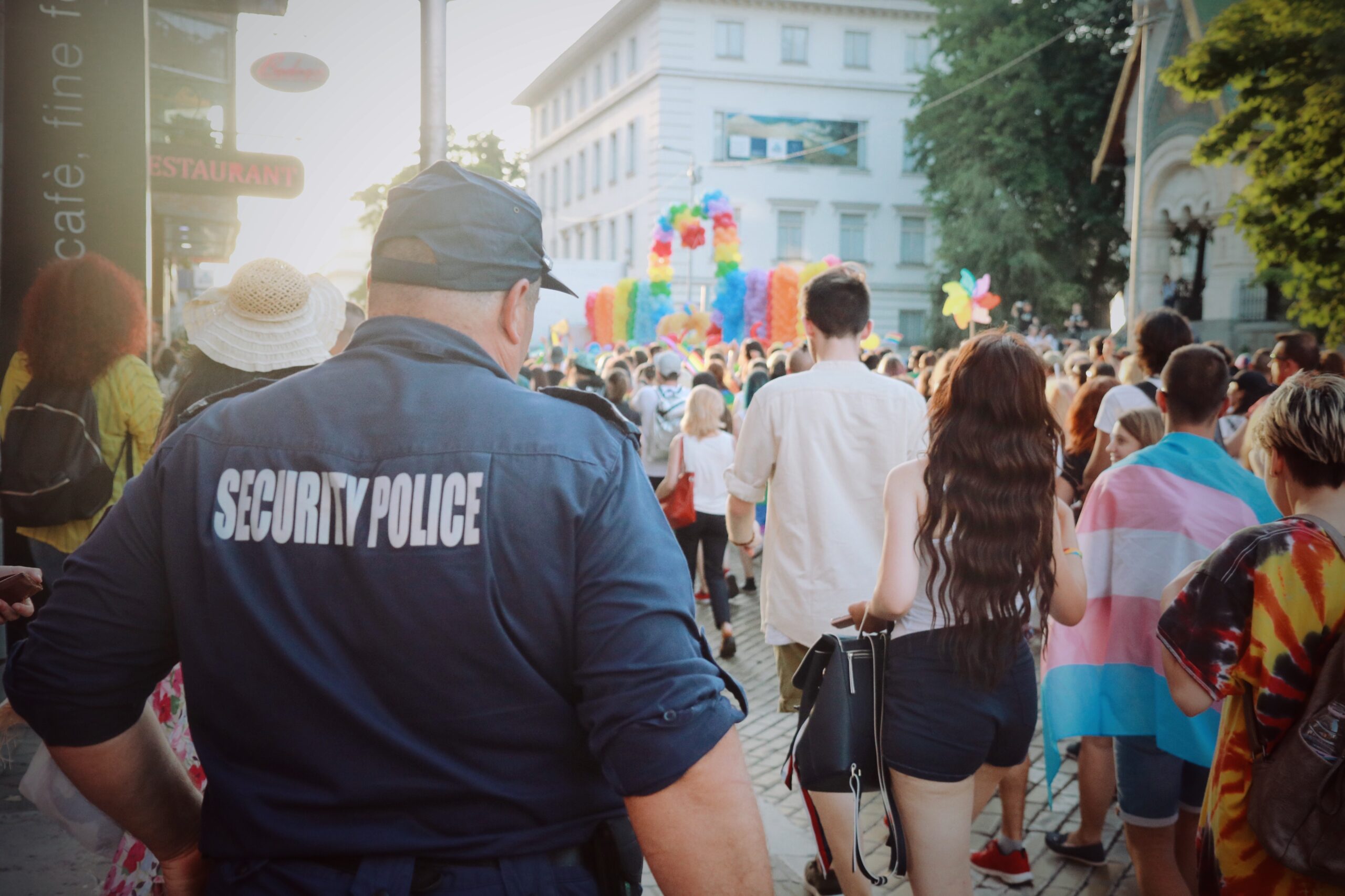 security crowd control worker guard on street busy festival parade