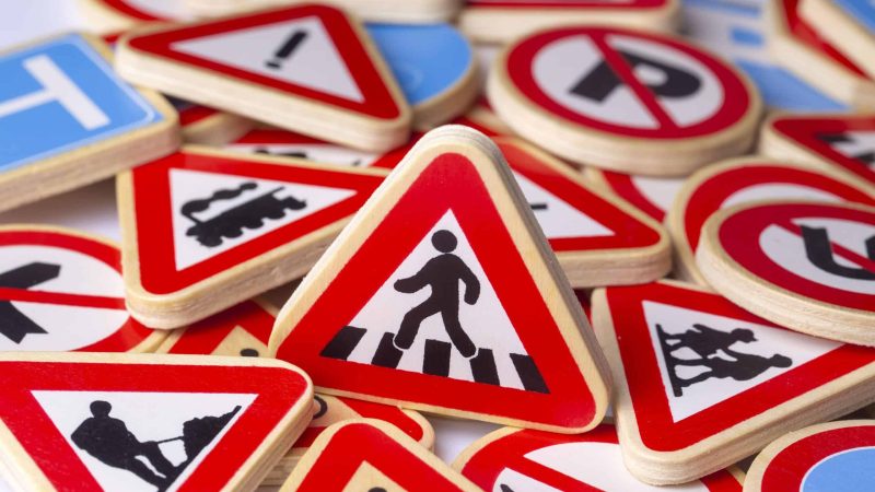 Wooden replica traffic signs in different shapes