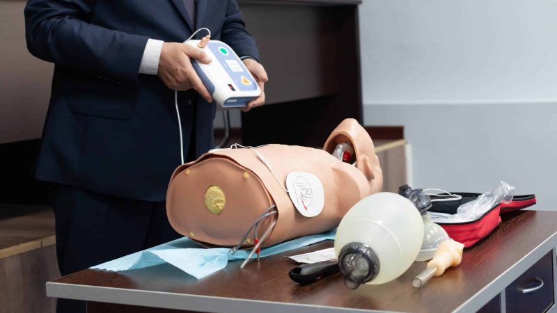 how to use a defibrillator (AED) in the workplace